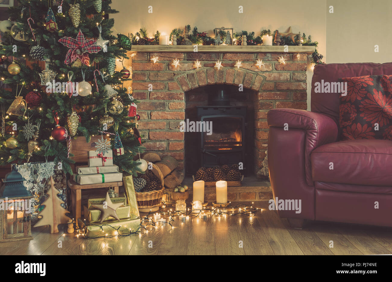 Cozy Fireplace With Woodburner Lit Up Christmas Tree With Baubles