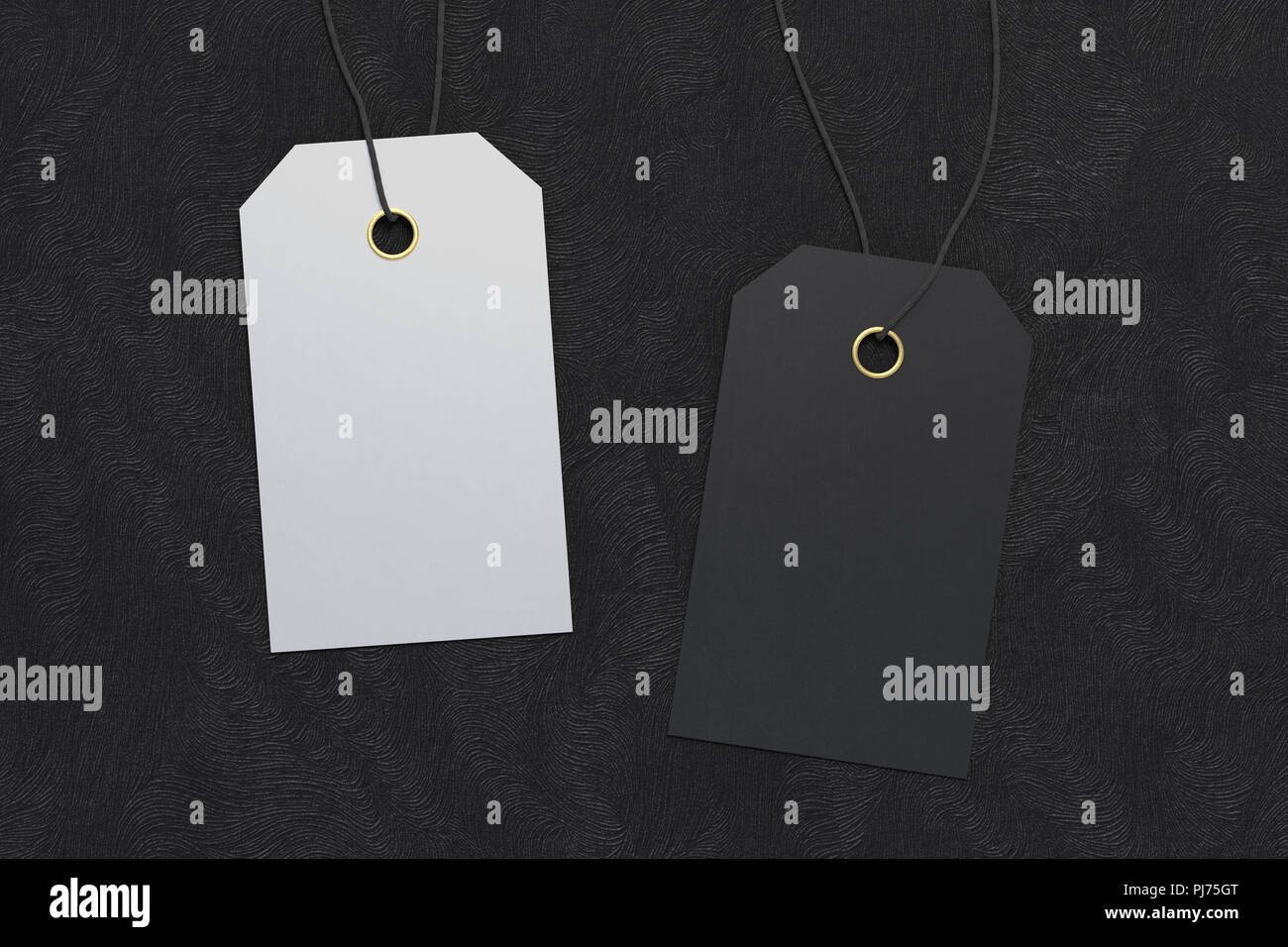 Two blank black and white price tag labels mockup on black background