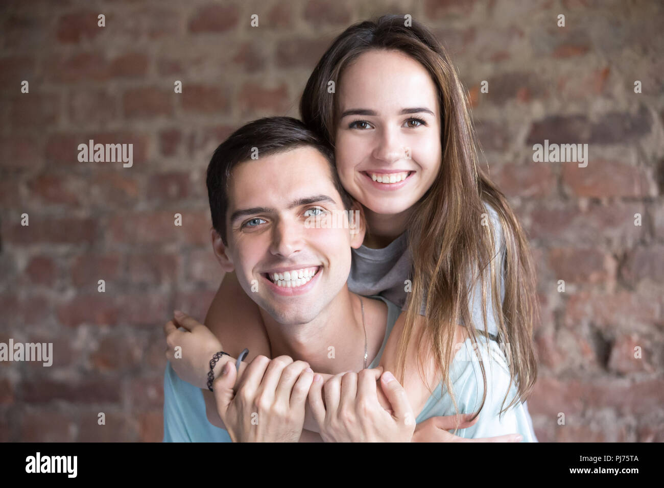 Close up portrait of smiling happy young man and woman Stock Photo