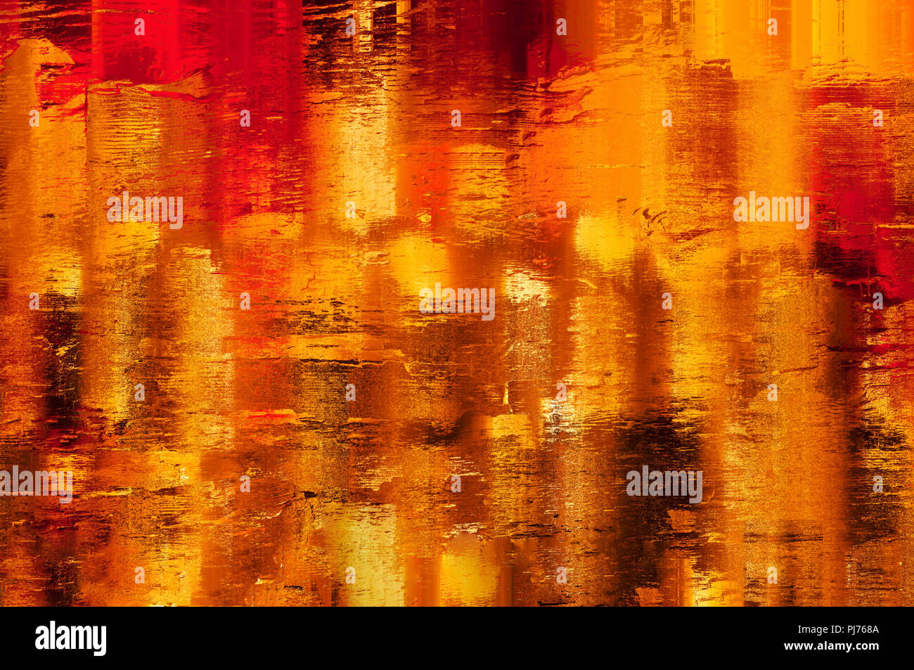 Shining, warm, yellow, amber, gold and orange abstract background texture. Appearance of lights reflected in wet surface. Painterly effect. Stock Photo