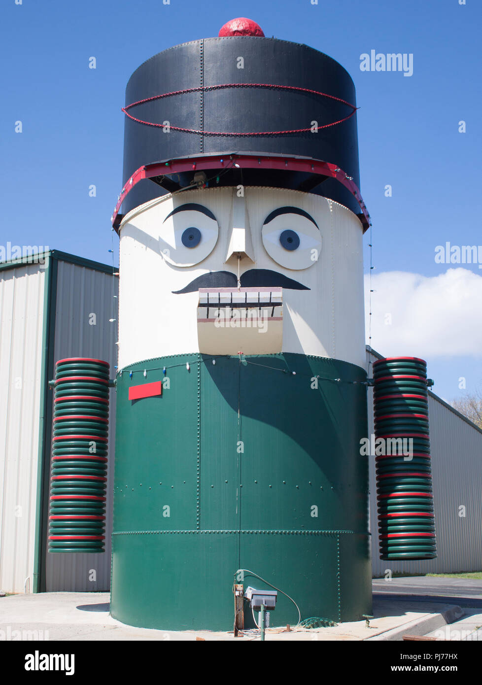 In Orange, Virginia, a grain silo is cleverly transformed into a giant Nutcracker head, blending farm life with festive roadside art. Stock Photo