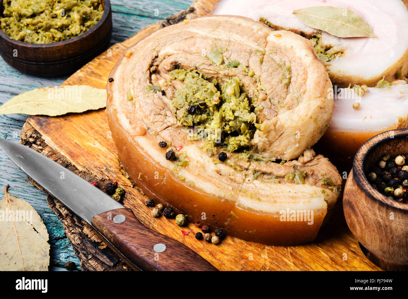 Homemade boiled lard with pesto sauce and spices.Rural food Stock Photo