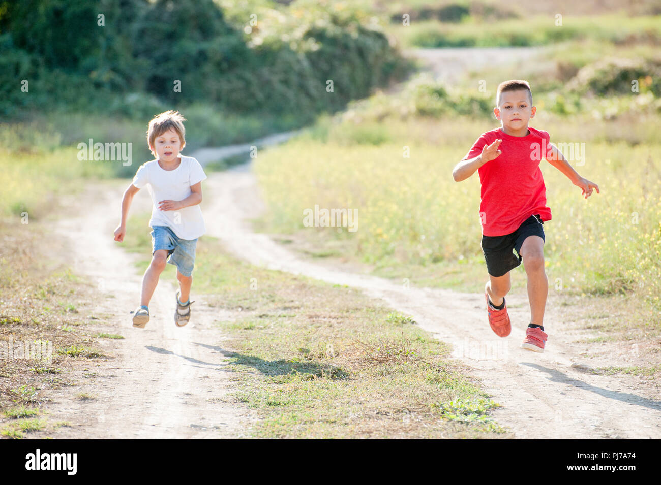 two running healthy little boys 