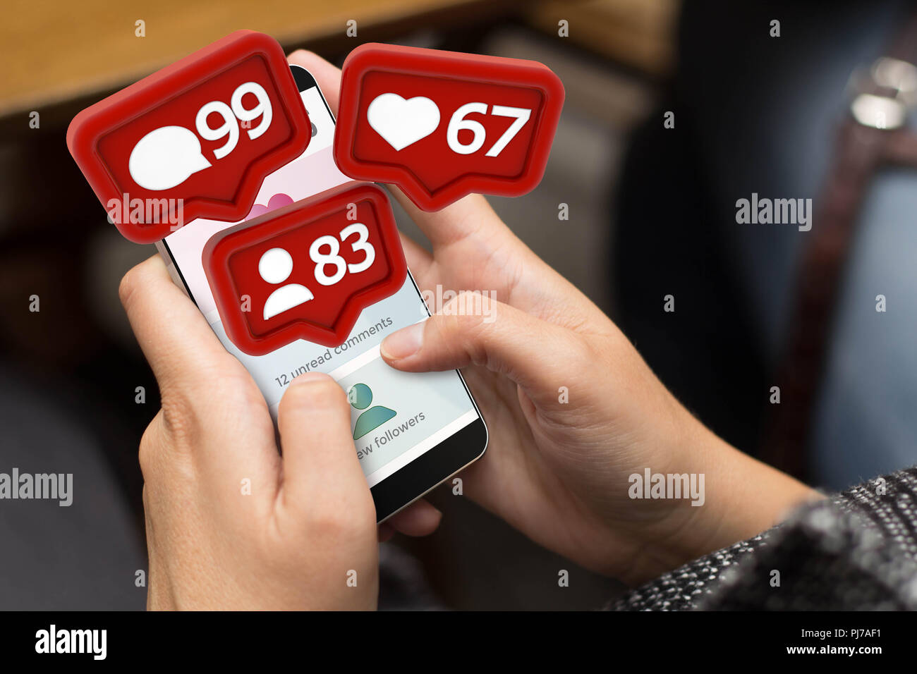 girl using a digital generated phone with social media notifications. All screen graphics are made up. Stock Photo