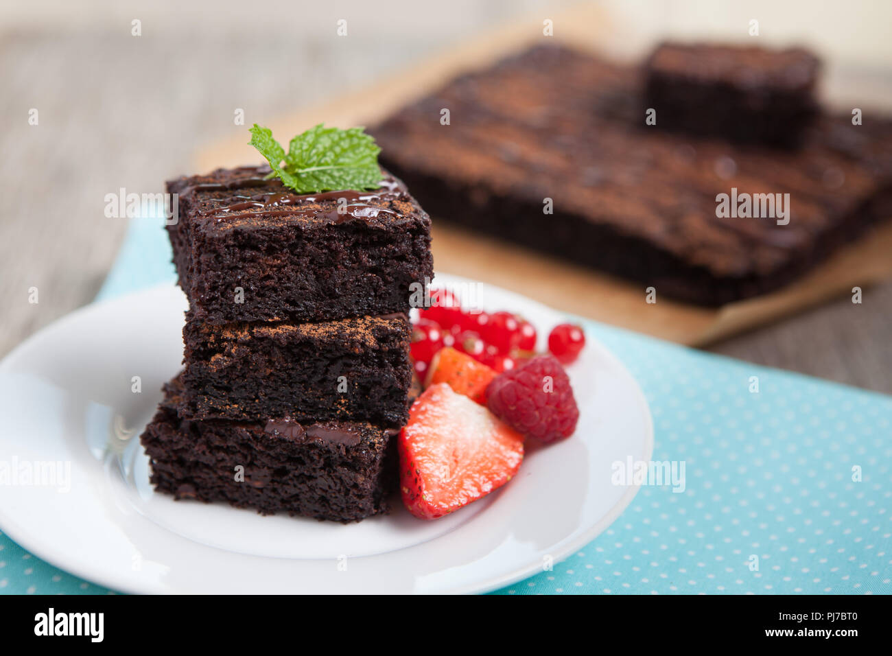 Healthy gluten free brownies made with sweet potato and coconut flour. Paleo style brownies on a wooden table, selective focus Stock Photo