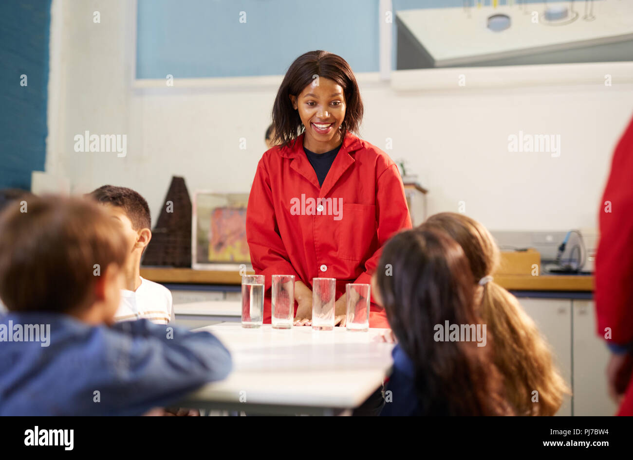 Science teacher and students in laboratory Stock Photo
