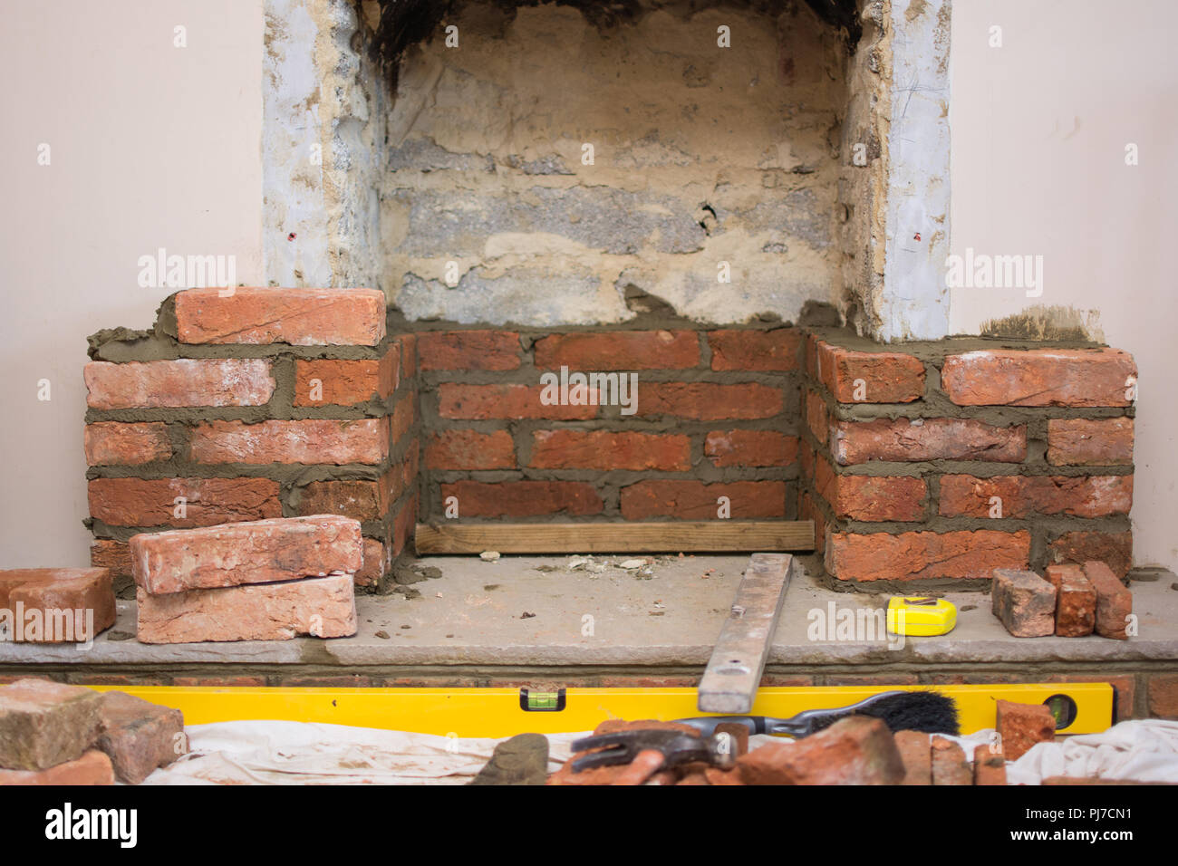 Indoor Diy Project Building Fireplace In The House Laying Bricks