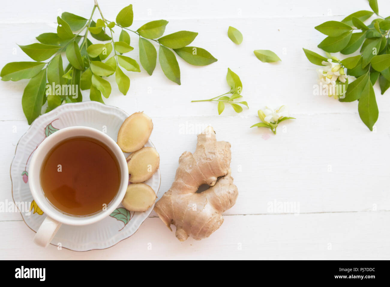 herbal health care hot ginger juice cough sore with flower on