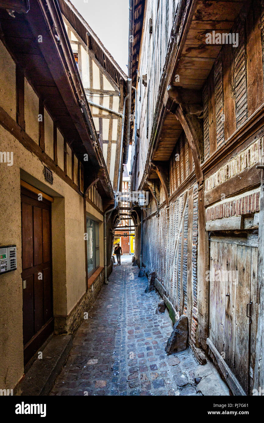 Narrow medieval alley way in historic centre of Troyes with half timbered buildings in Troyes, Aube, France on 31 August 2018 Stock Photo
