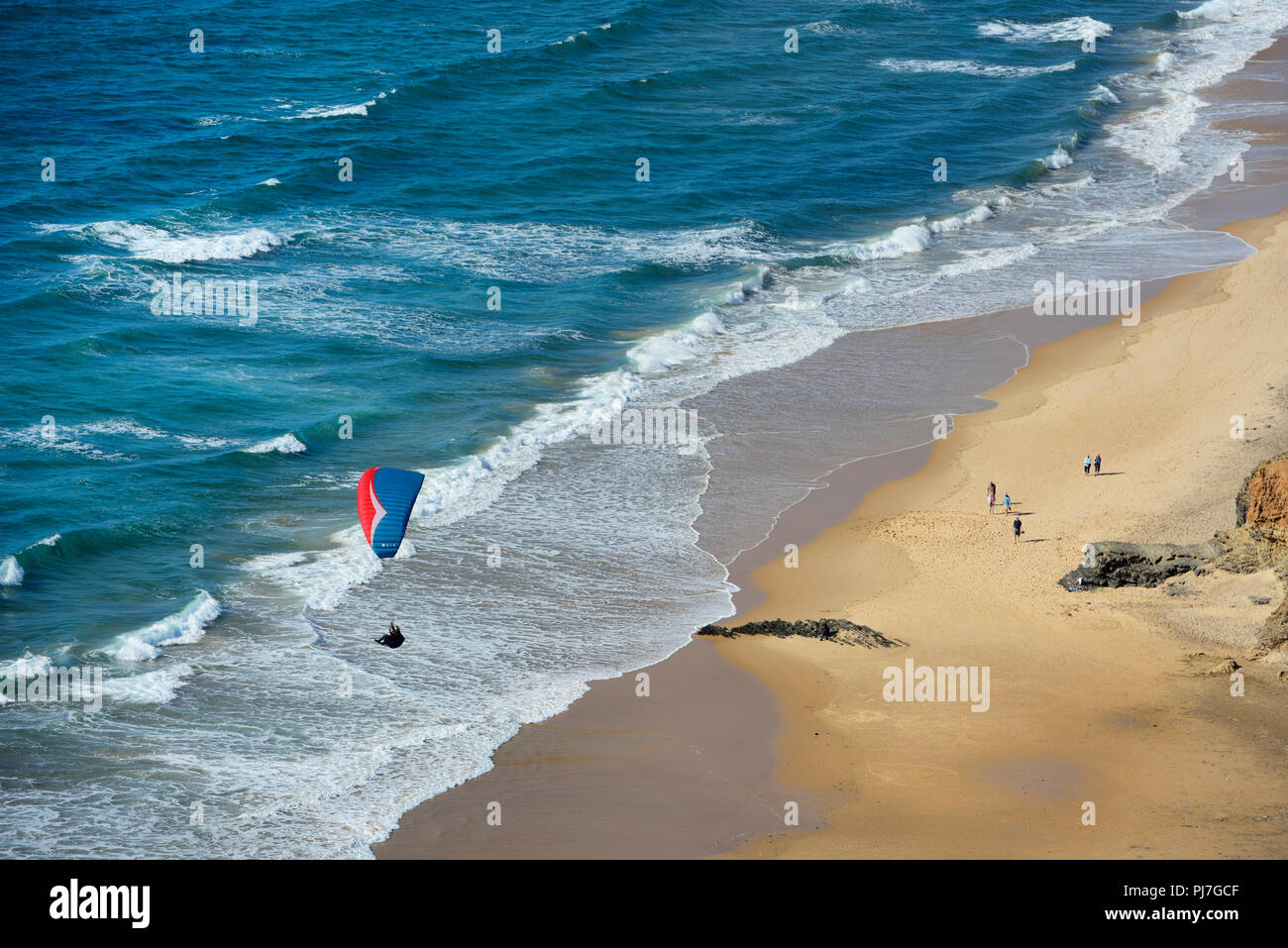 Paragliding over Cordoama beach. Algarve, Portugal Stock Photo