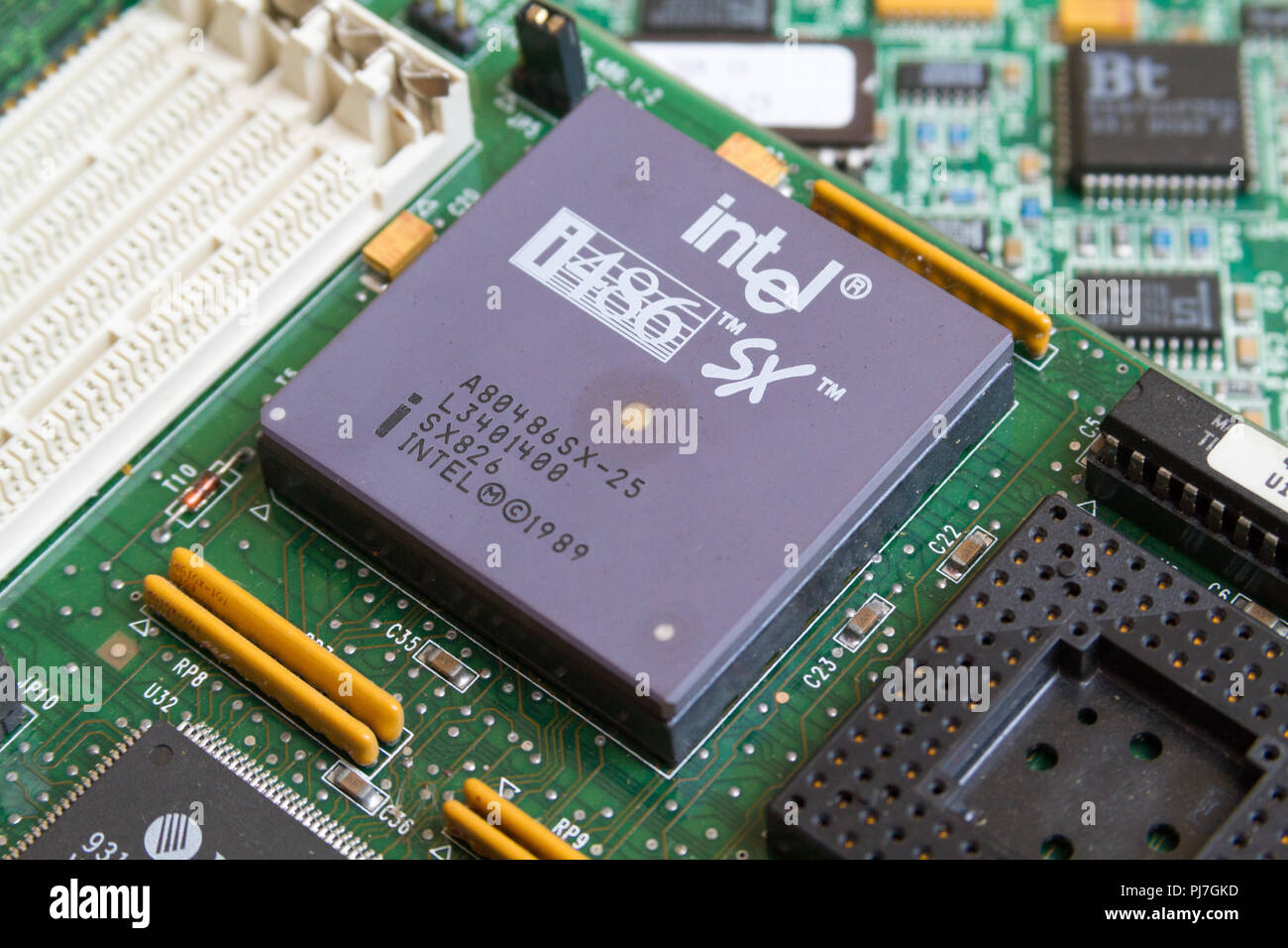 An Intel i486 SX (80486SX) processor (CPU) from 1989 in a socket on a motherboard. Caklov, Slovakia. 2018/7/28. Stock Photo