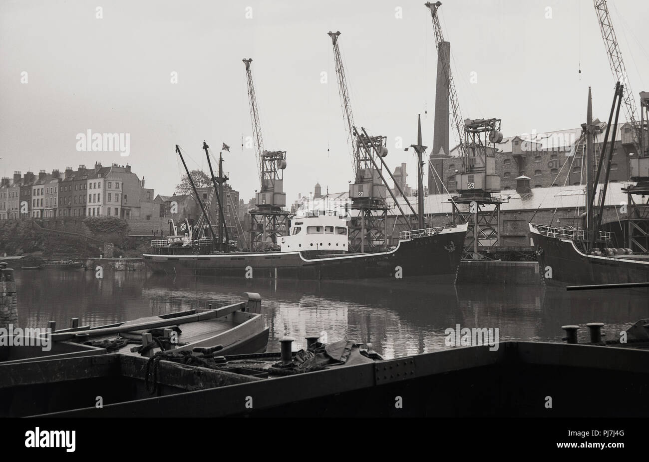 1950s, historical, waterfront, cranes and ships mooted at Bristol docks ...