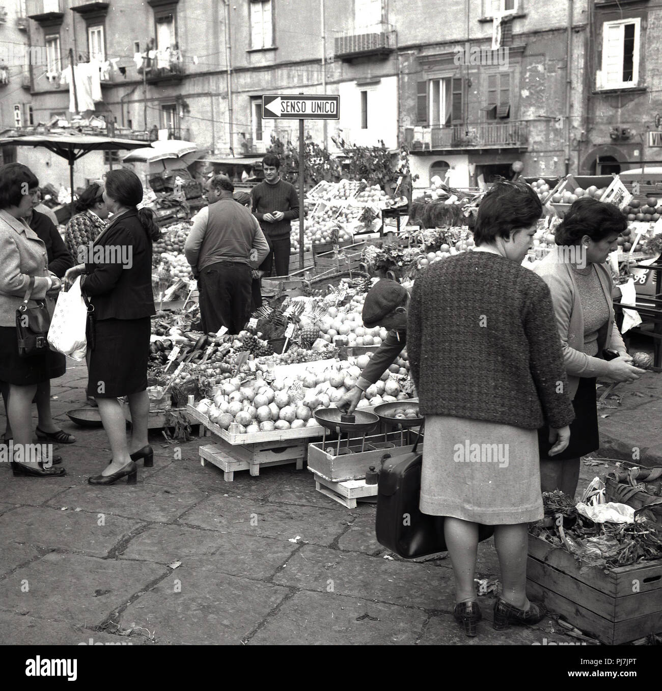 1960s, Naples, Italy, female Italian shoppers outside at a local street market. Stock Photo