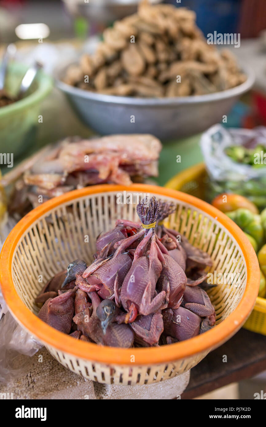 Dead birds chicks meat for sale at burmese market in Myanmar. Stock Photo