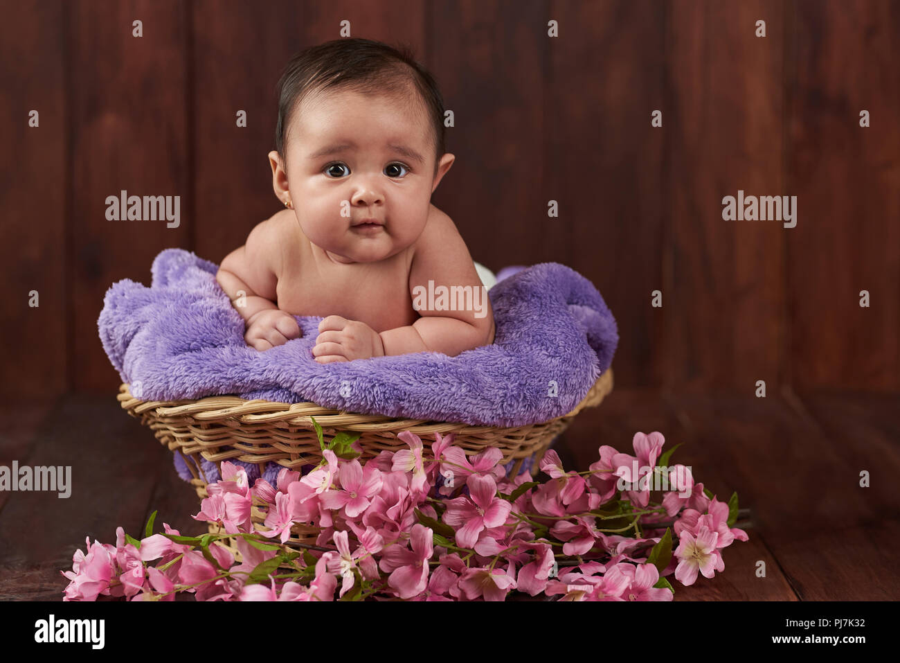 Smile happy cute baby girl on dark wooden background Stock Photo ...