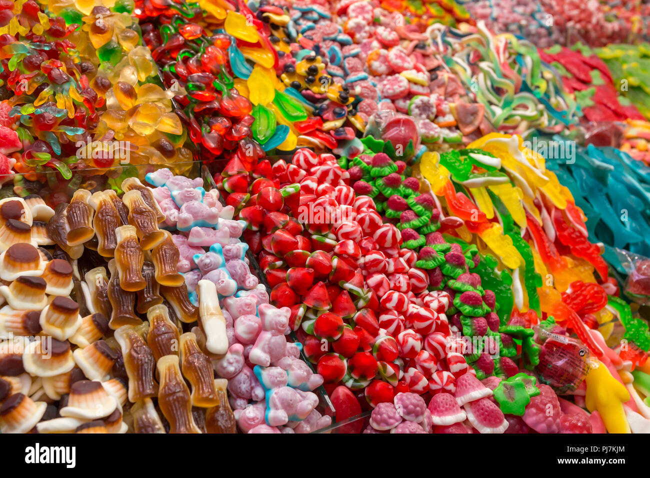 Assorted gummy candies in the shop. Jelly sweets in different shapes and colors Stock Photo