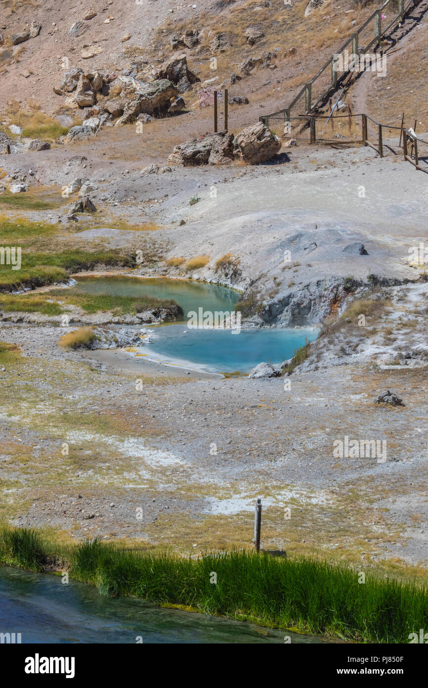 Hot Creek is part of The Long Valley Caldera hosts an active hydrothermal system that includes hot springs, fumaroles steam vents and mineral deposits Stock Photo