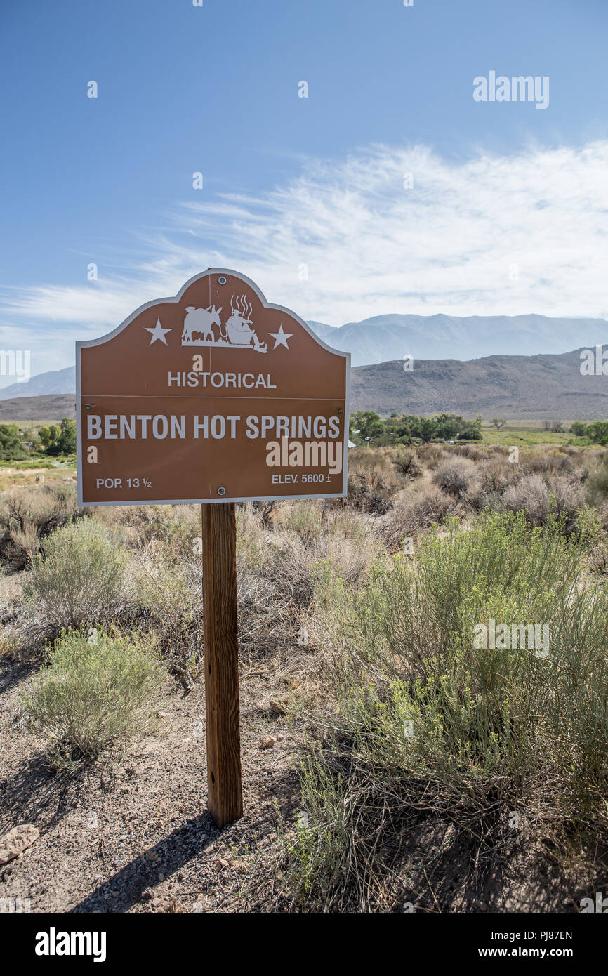 Roadside sign at Historical Benton Hot springs showing a population of 13 and a half, on highway 120 in California USA Stock Photo
