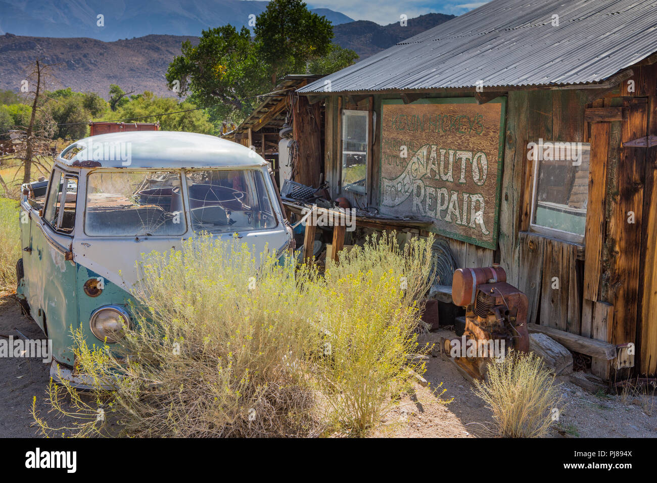 Old rusting Volkswagen van and  in the town of Benton Hot Springs on Highway 120 in California USA Stock Photo