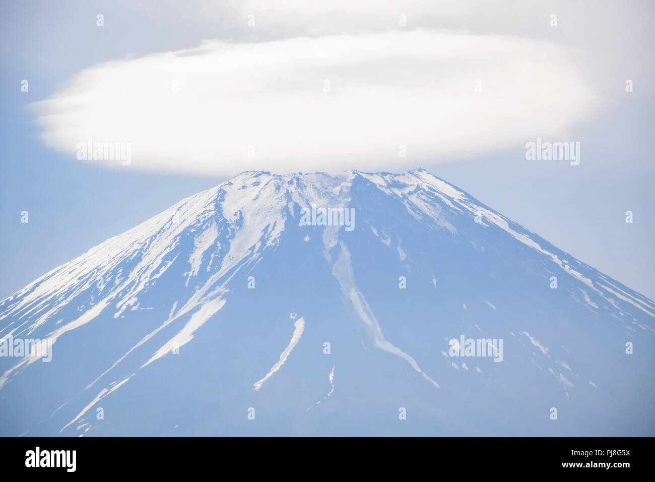 Mount Fuji view with cloud on top of its peak at Fuji Shibazakura moss phlox Festival in Kawaguchiko, Japan Stock Photo