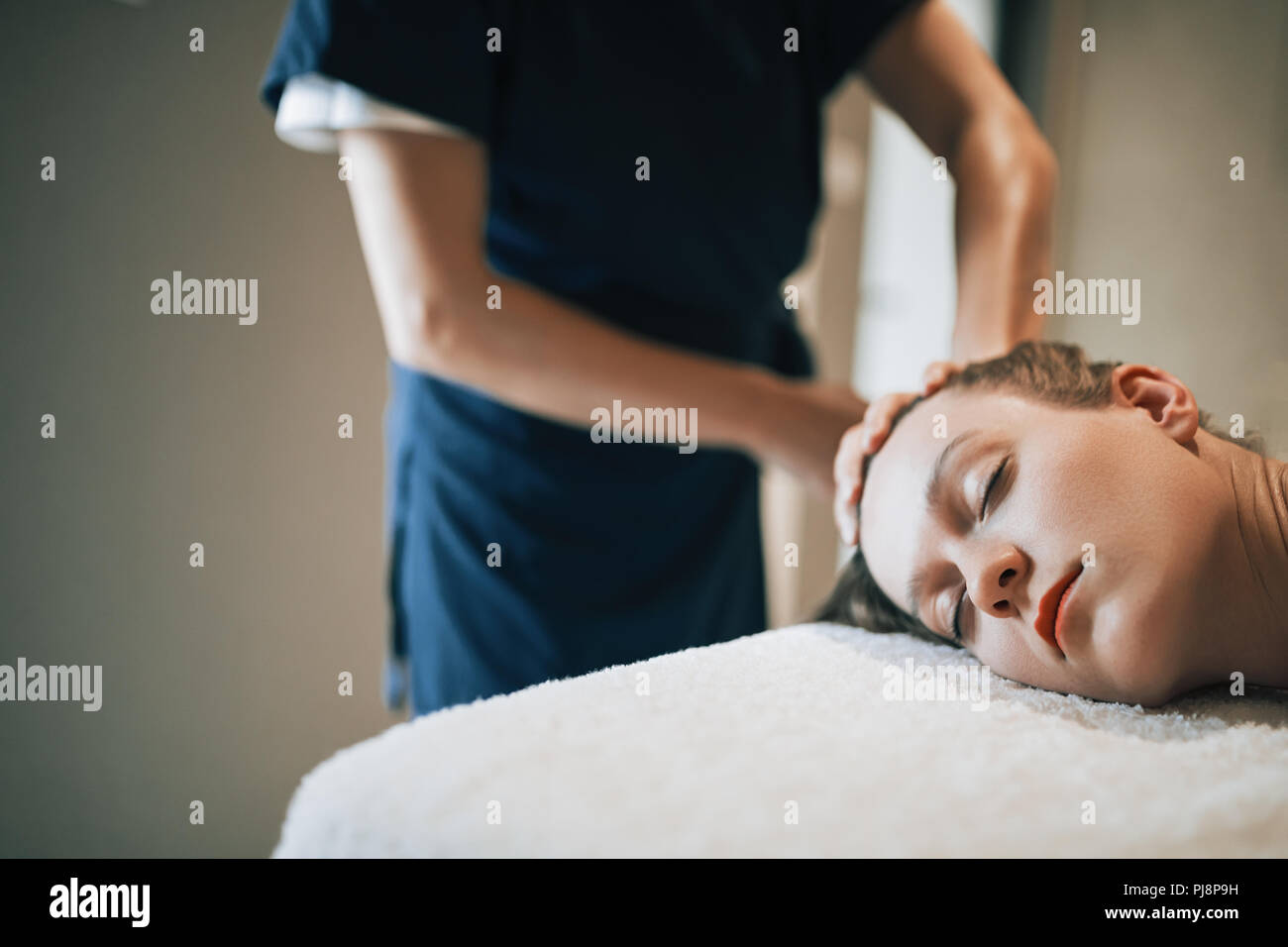 Rejuvenating relaxing massage by masseur Stock Photo Alamy