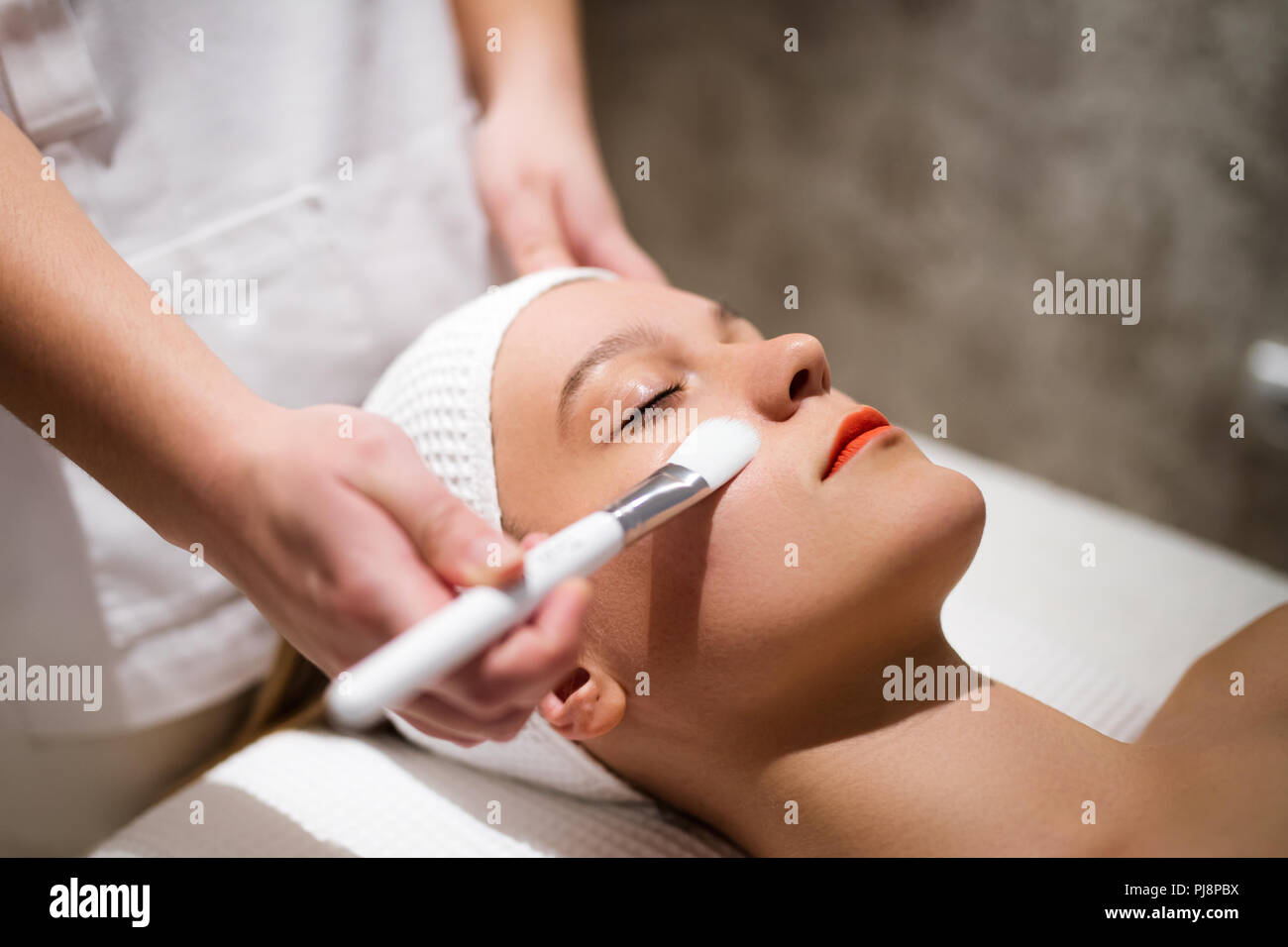 Cosmetic and massage treatment at wellbeing saloon Stock Photo