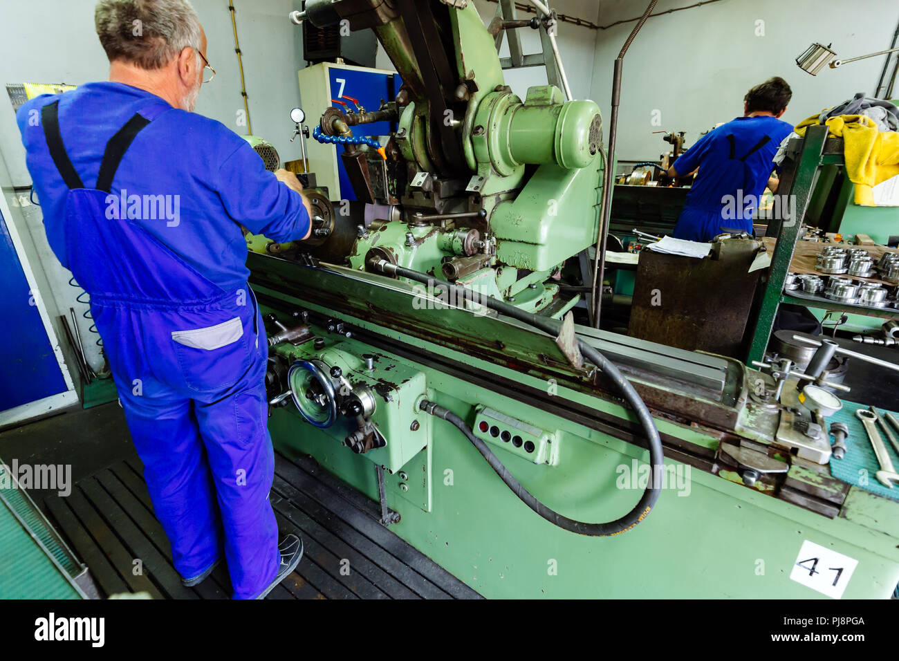 Two technicians working in factory Stock Photo