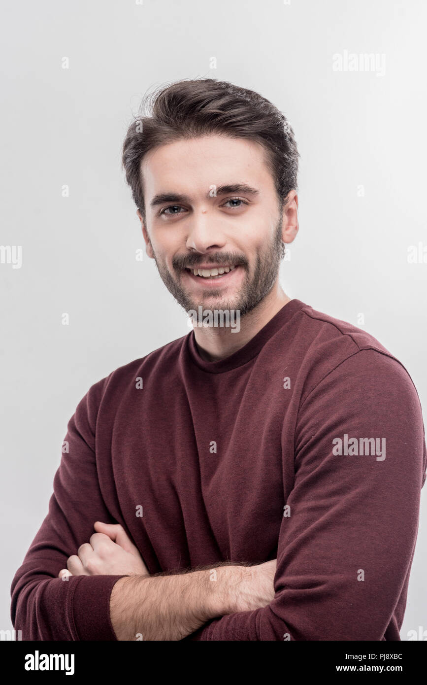 Handsome Beaming Dark Haired Man Wearing Plain Dark Red Shirt