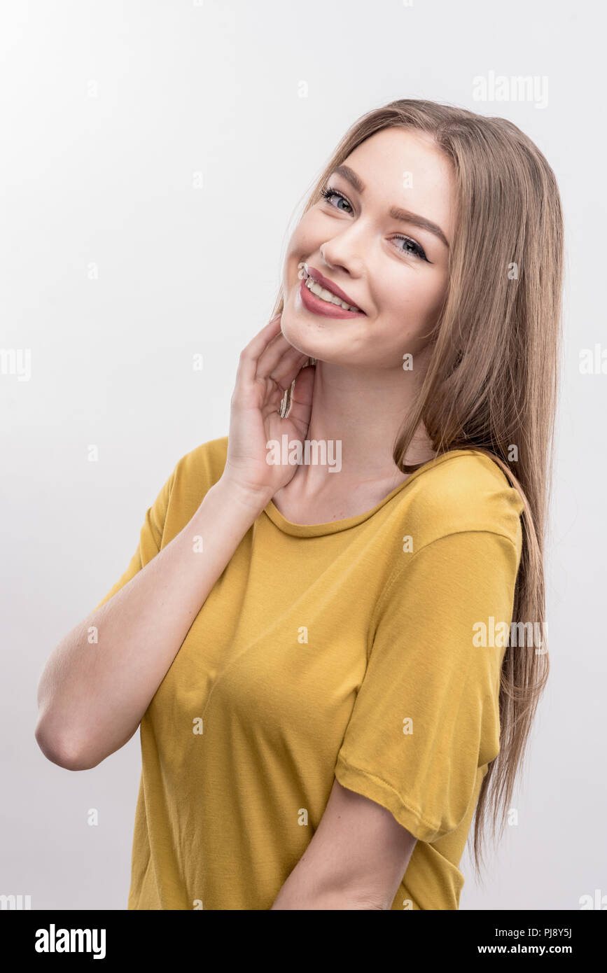 Beaming appealing blonde-haired student feeling extremely happy Stock Photo