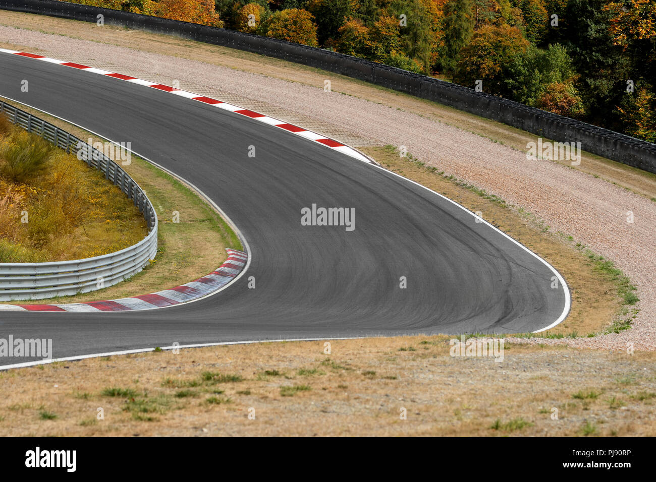 View on empty race track circuit with red white curbs motorsport concept racing background Stock Photo