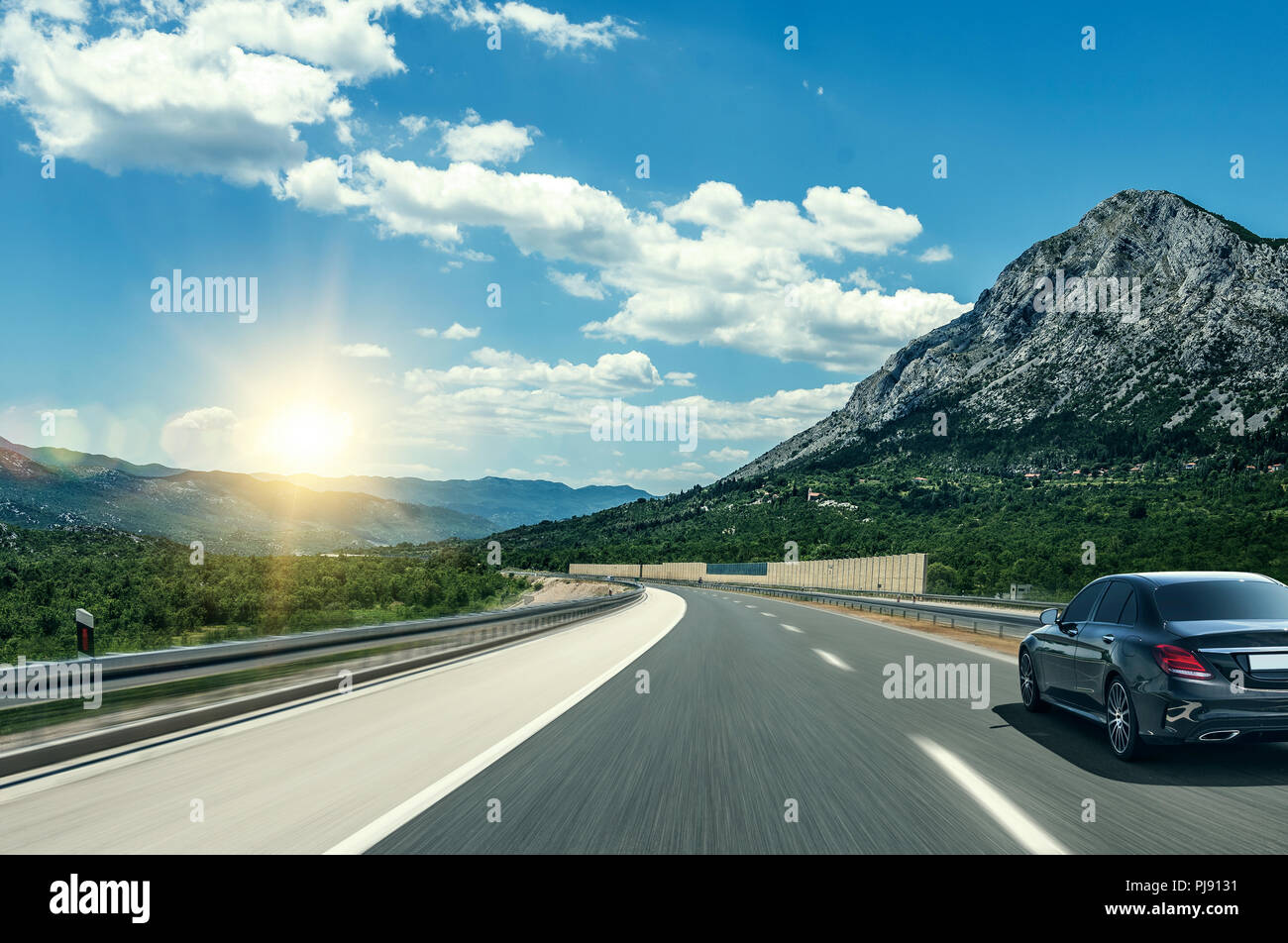 Black sedan driving in hi-res stock photography and images - Alamy