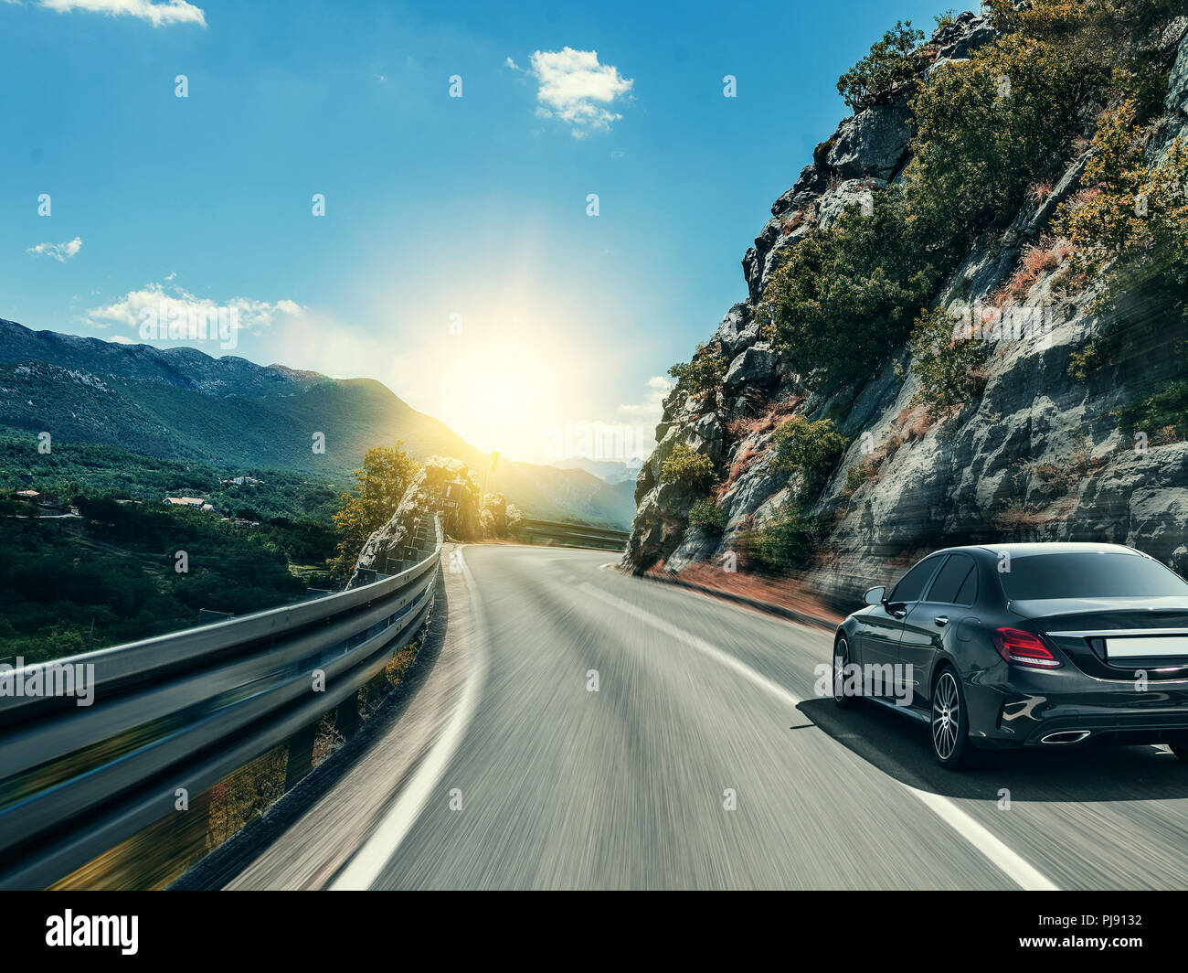 White sedan driving along hi-res stock photography and images - Alamy