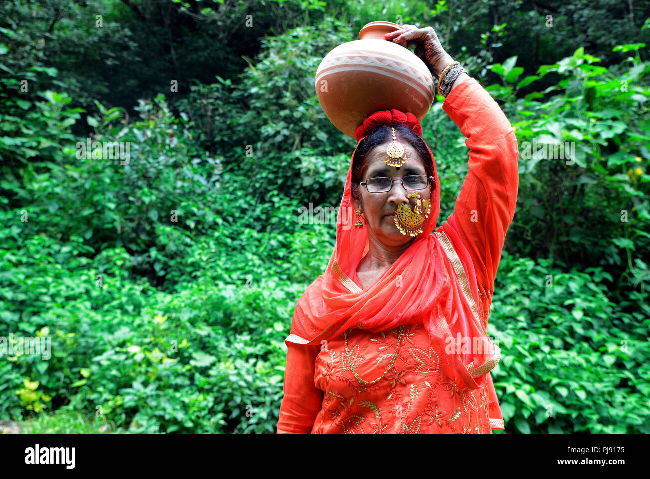 Woman carrying water pot on Her Head Stock Photo Alamy