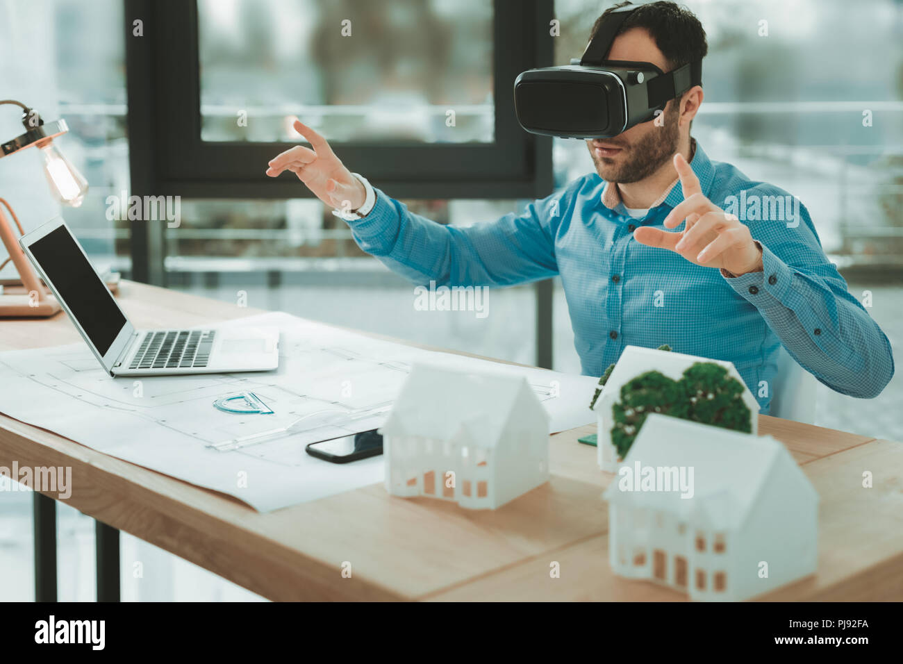 Nice pleasant man using 3d glasses Stock Photo