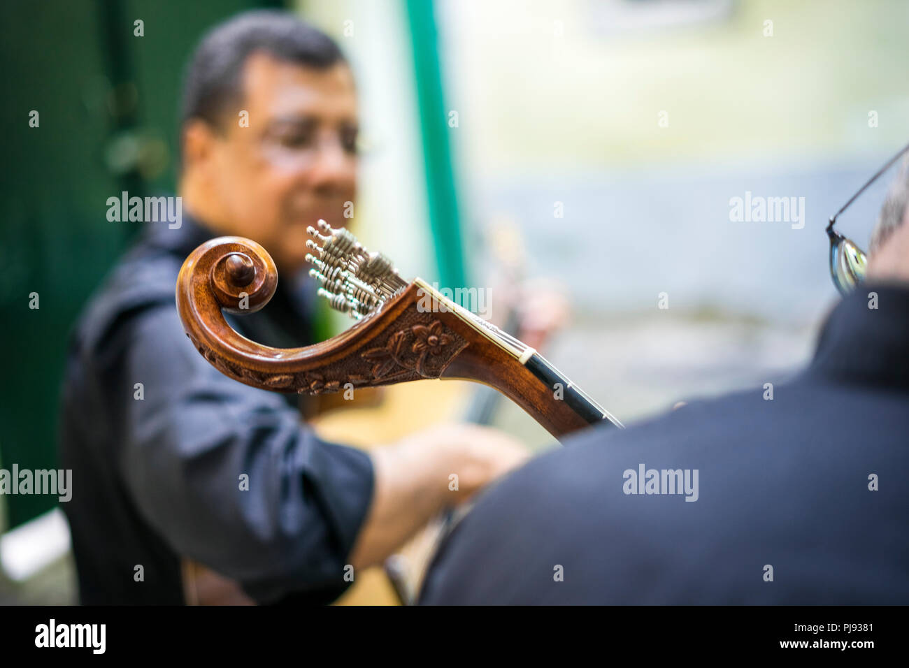 Two fado guitarists with acoustic and portuguese guitars in Alfama ...