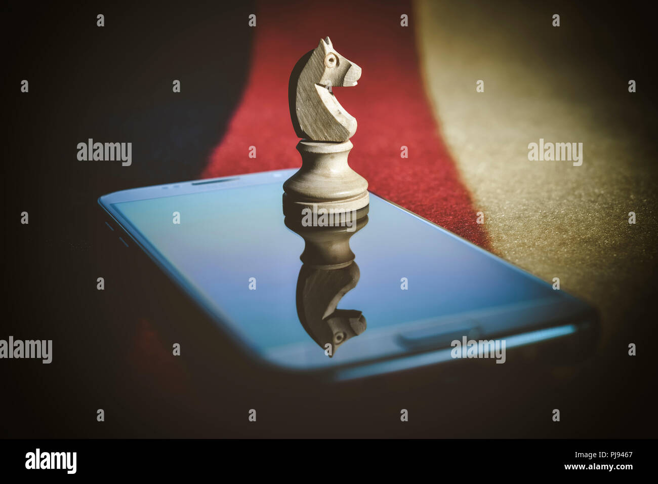 Jumper's figure on a mobile phone, symbolic photo state Trojan and quiet SMS, Springer-Figur auf einem Handy, Symbolfoto Staatstrojaner und stille SMS Stock Photo