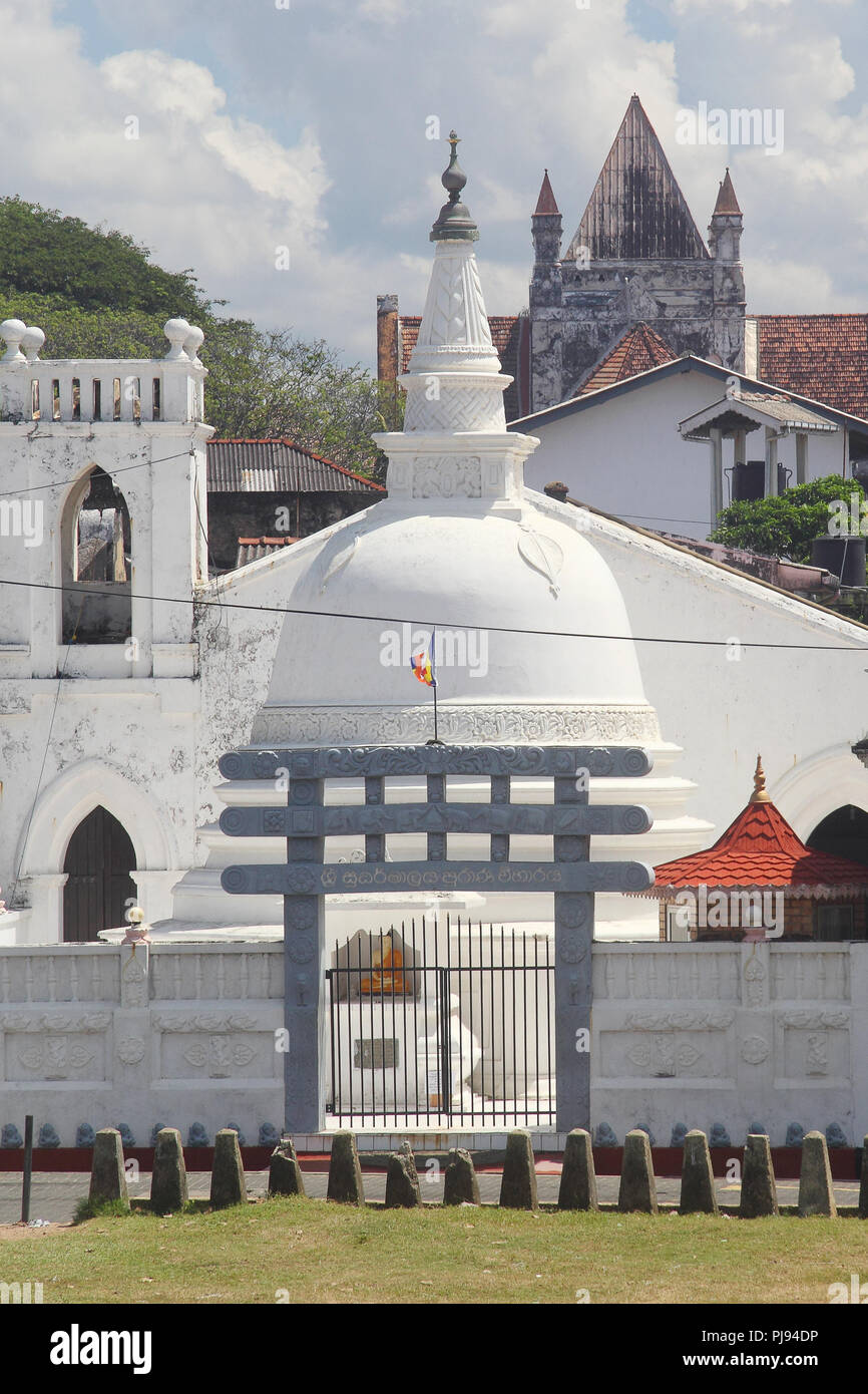 Buddhist stupa and catholic church in Galle, Sri lanka Stock Photo