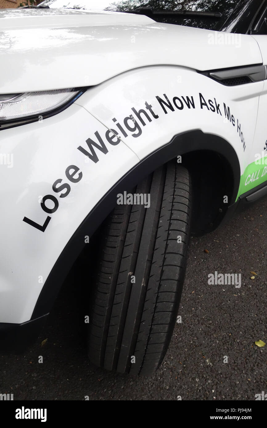 ' Lose weight now, ask me how' written on a wheel arch on a Herbalife ...