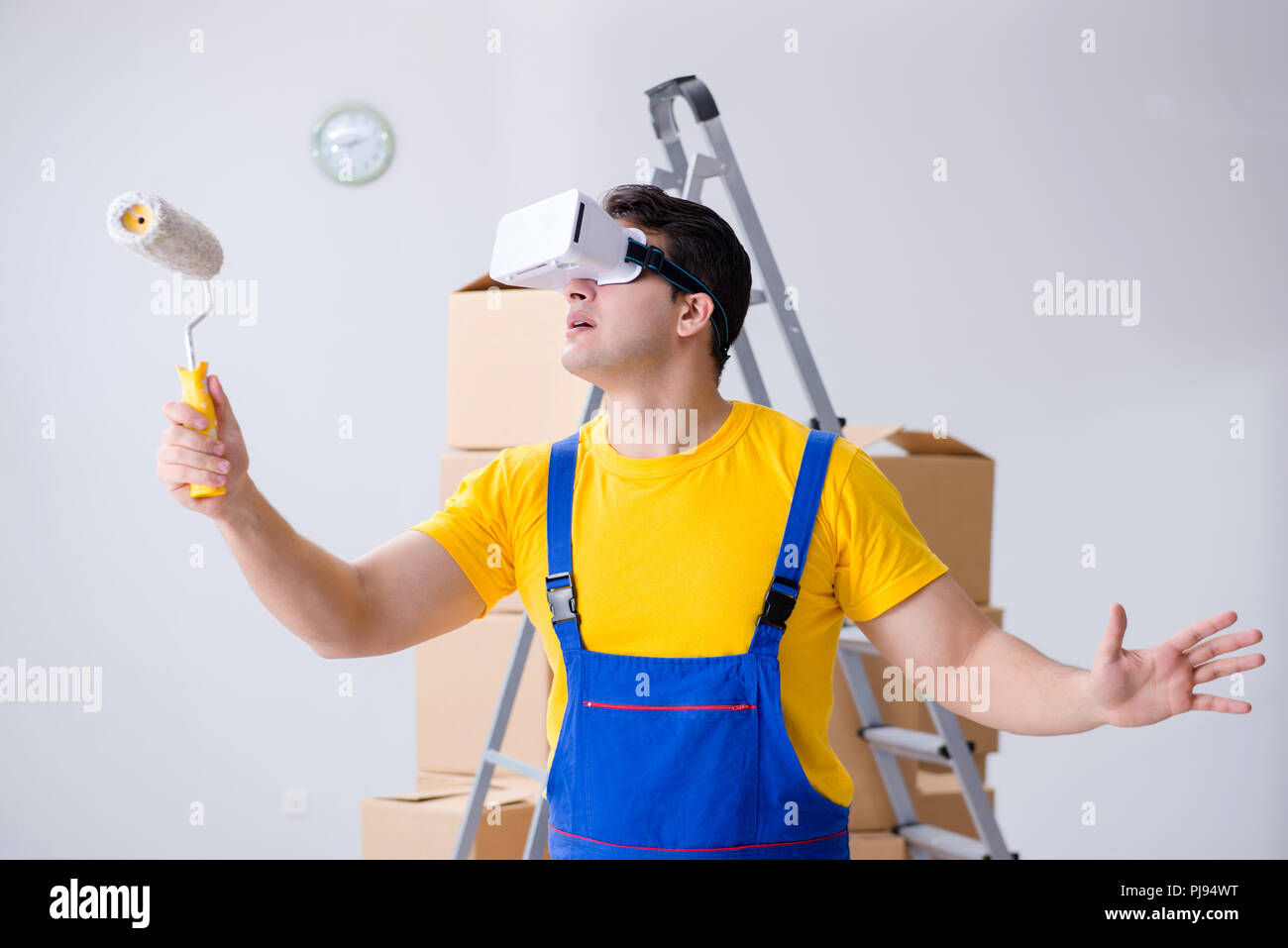 Painter contractor working with virtual reality goggles Stock Photo