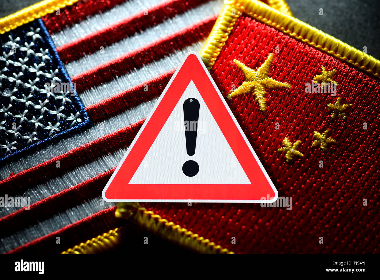 Flags of the USA and China with warning, commercial war, Fahnen von USA und China mit Warnschild, Handelskrieg Stock Photo