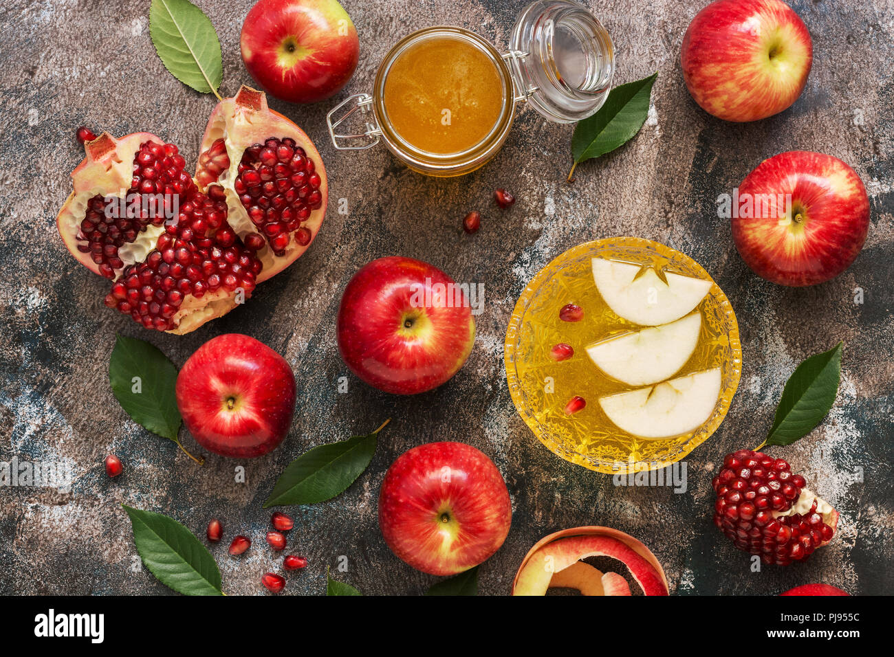Red apples, pomegranate and honey. New Year Rosh Hashana. Traditional Jewish food. Top view