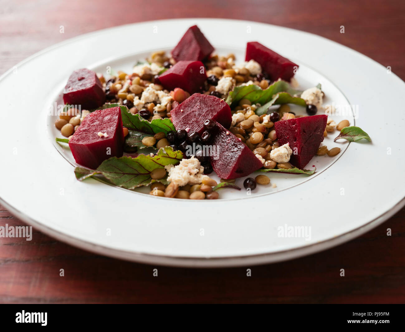 Lentil, beet salad with home made vegan feta Stock Photo