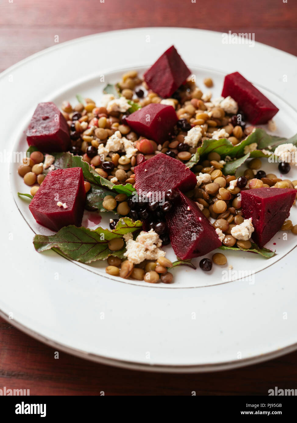 Lentil, beet salad with home made vegan feta Stock Photo