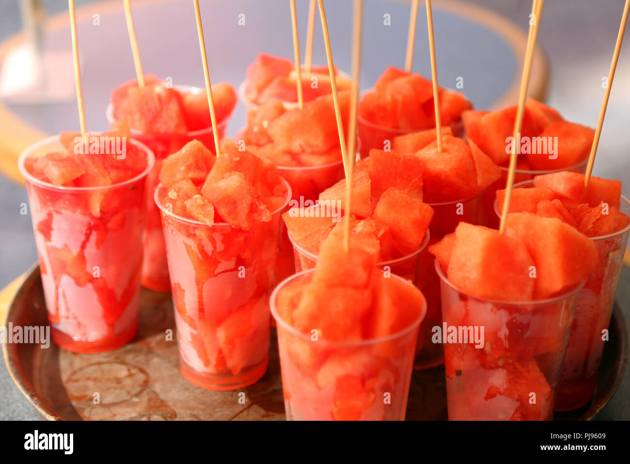 red pieces of ripe watermelon in glasses on sale at the bar Stock Photo