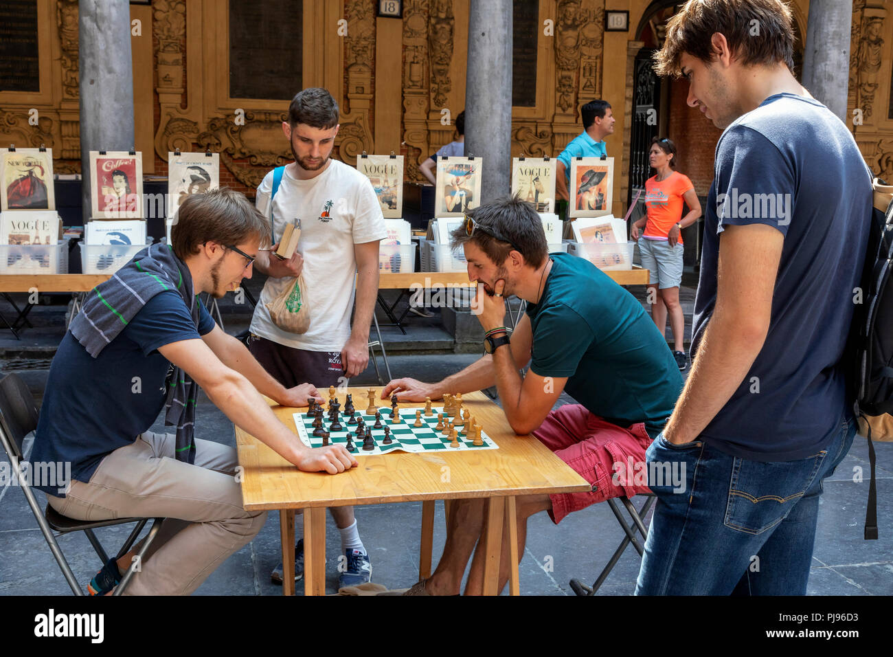 Two men playing chess in the old book, music and antiques market, held in Vielle Bourse de Lille, Place du General de Gaulle, Lille, France Stock Photo
