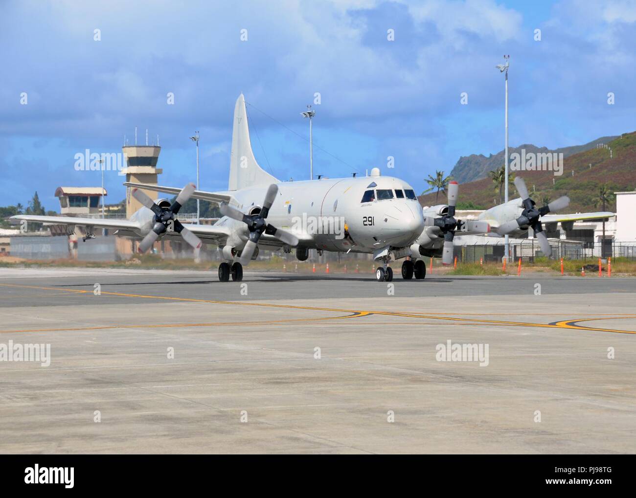 MARINE CORPS BASE HAWAII (July 5, 2018) — A Patrol Squadron (VP) 46 P-3C Orion arrives on Marine Corps Base Hawaii for Rim of the Pacific (RIMPAC) Exercise. Twenty-five nations, more than 46 ships and 5 submarines, about 200 aircraft, and 25,000 personnel are participating in RIMPAC from June 27 to Aug. 2 in and around the Hawaiian Islands and Southern California. The world's largest international maritime exercise, RIMPAC provides a unique training opportunity while fostering and sustaining cooperative relationships among participants critical to ensuring the safety of sea lanes and security  Stock Photo
