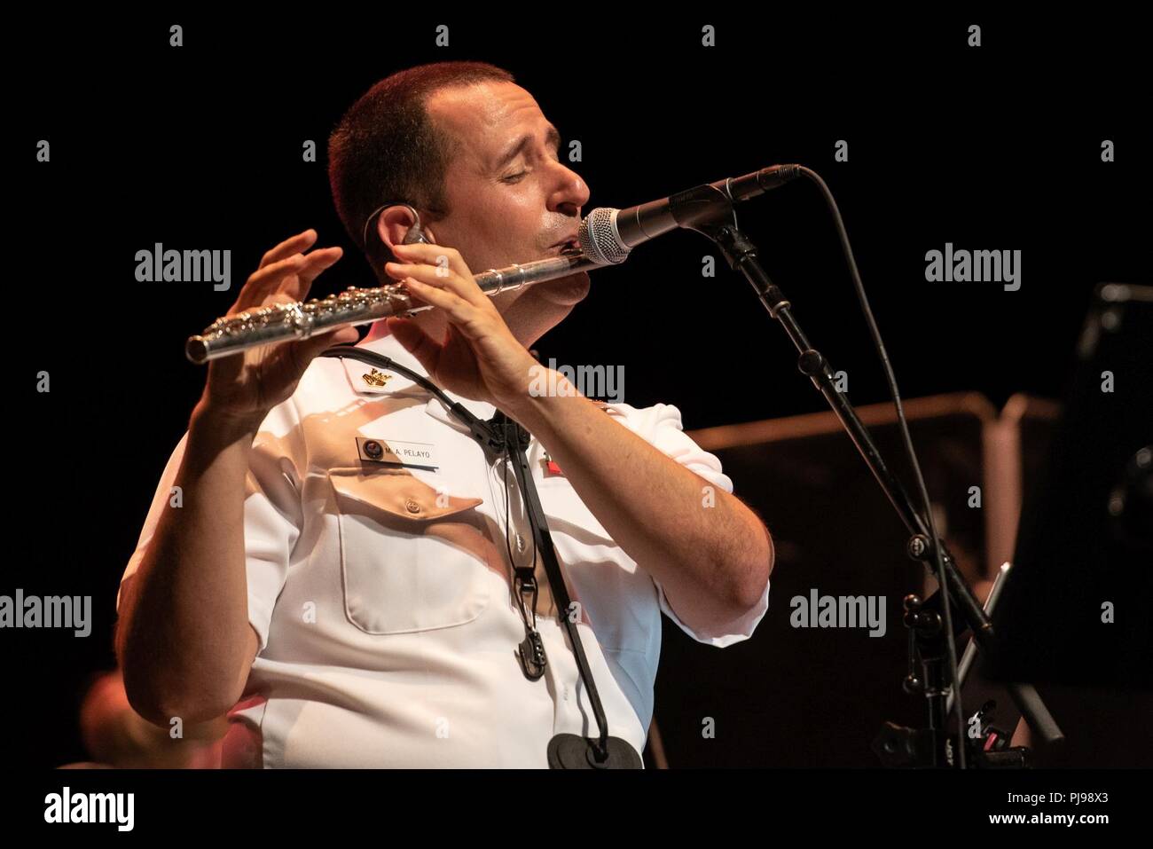 DAVIE, Fla. (July 8, 2018) Musician 1st Class Manuel Pelayo de Gongora performs with the U.S. Navy Band Cruisers popular music group during a concert at Broward College's Bailey Hall in Davie, Fla. The Navy Band performed in seven cities in Florida, connecting communities to the Navy and building awareness and support for the Navy. Stock Photo