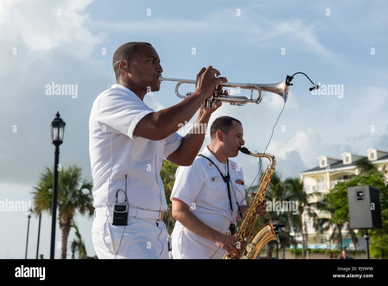KEY WEST, Fla. (July 9, 2018) Musicians 1st Class David Smith, left, and Manuel Pelayo de Gongora perform with the U.S. Navy Band Cruisers popular music group during a concert at Mallory Square in Key West, Fla. The Navy Band performed in seven cities in Florida, connecting communities to the Navy and building awareness and support for the Navy. Stock Photo