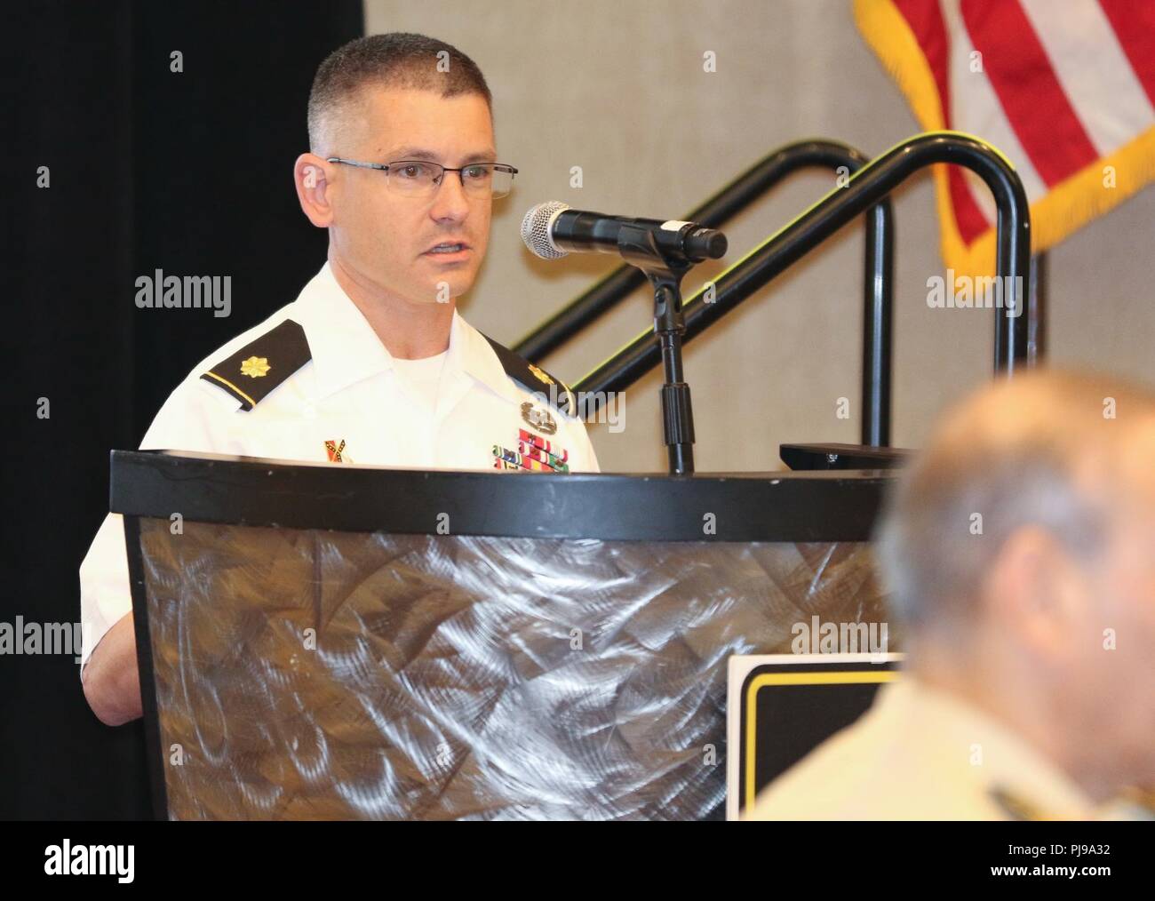 Maj. Ryan O’Reilly, strategic planner, U.S. Army Central, introduces the concept of a Coalition Land Operations Center as a driver for coalition interoperability that would operationalize a regional land power network between USARCENT and partner nations at the 2018 Senior Strategy Session – Arabian Peninsula / Levant in Arlington, Va, July 10, 2018. Ideally, CLOC would better enable mission command, information and intelligence sharing, collaboration and standardization for potential coalition constructs in advance of crises and future operations. Over the four-day conference, speakers and pa Stock Photo