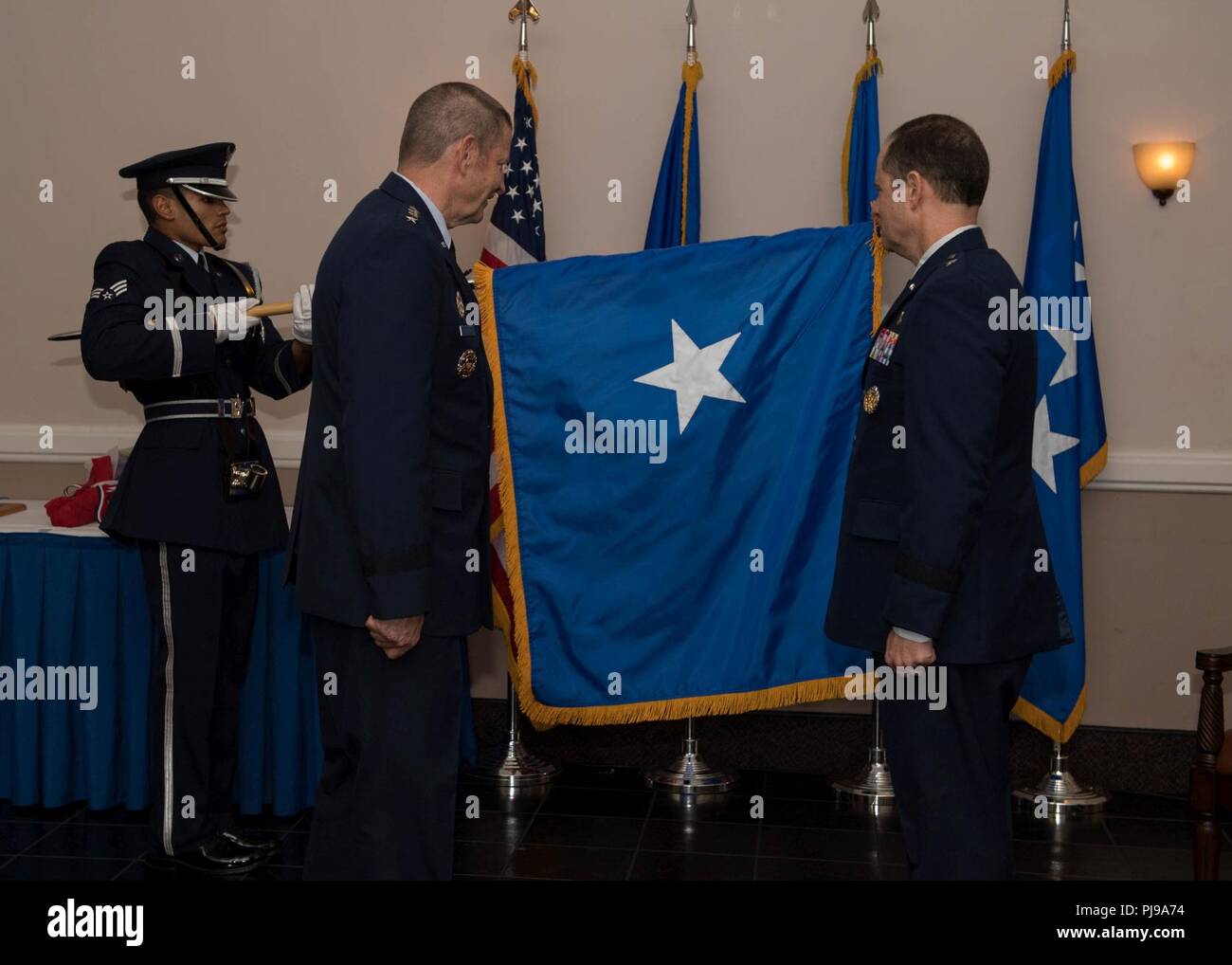 Brig. Gen. Eric H. Froehlich, Air Force Global Strike Command logistics, engineering and force protection director, promotes from the rank of Colonel to Brigadier General by Gen. Robin Rand, AFGSC commander, at Barksdale Air Force Base, La., July 6, 2018. Stock Photo